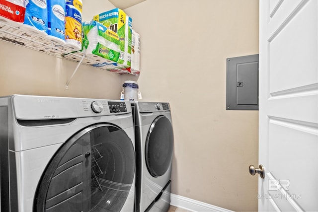 clothes washing area with independent washer and dryer and electric panel