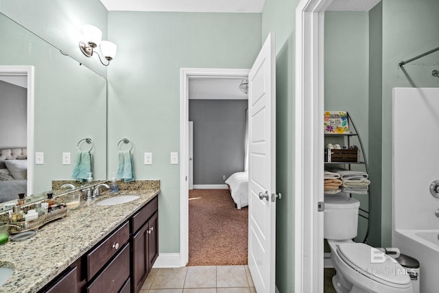 full bathroom featuring tub / shower combination, vanity, toilet, and tile patterned floors