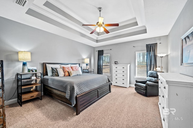 bedroom with crown molding, a raised ceiling, ceiling fan, and carpet floors