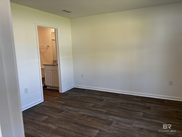 empty room featuring dark hardwood / wood-style floors