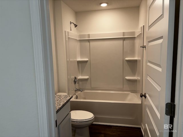 full bathroom featuring vanity, shower / washtub combination, hardwood / wood-style floors, and toilet