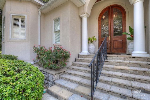 entrance to property featuring french doors