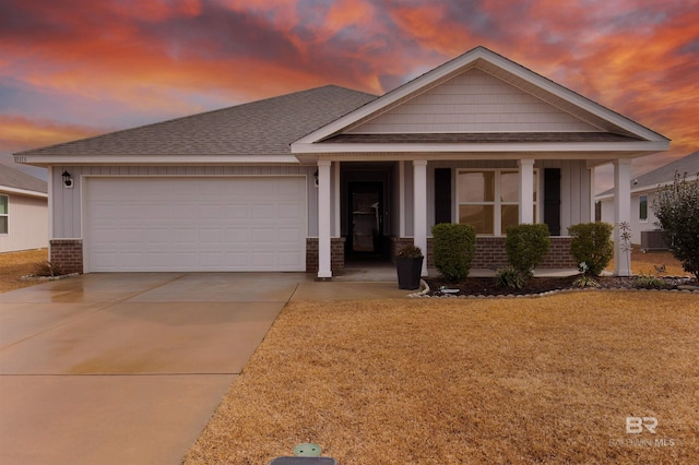 view of front of property with a garage and a porch