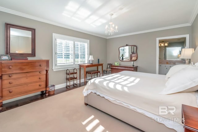 bedroom featuring connected bathroom, ornamental molding, dark wood-type flooring, and an inviting chandelier