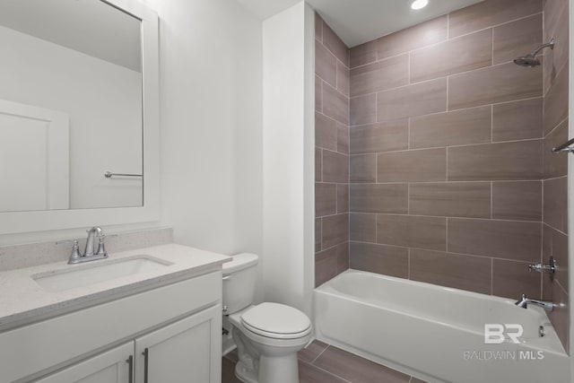 full bath featuring shower / bathtub combination, toilet, and vanity