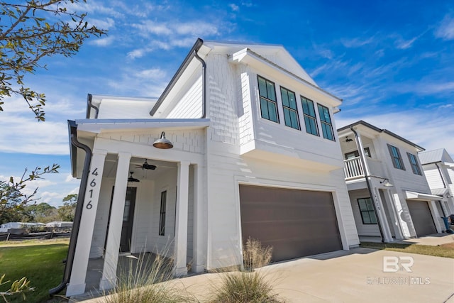 view of front of house featuring a garage and concrete driveway