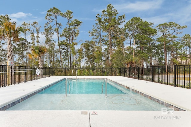 community pool featuring fence