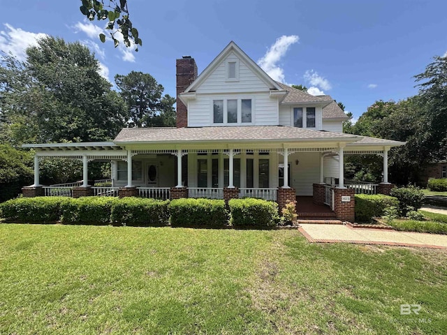 1619 Silver Creek Ct, Saraland, AL 36571 - view of front of home with covered porch, a front lawn, a chimney, and roof with shingles