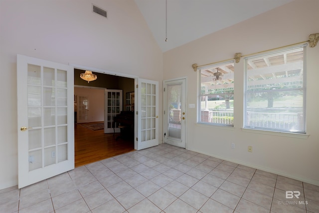 1619 Silver Creek Ct, Saraland, AL 36571 - unfurnished room featuring french doors, light tile patterned floors, and high vaulted ceiling