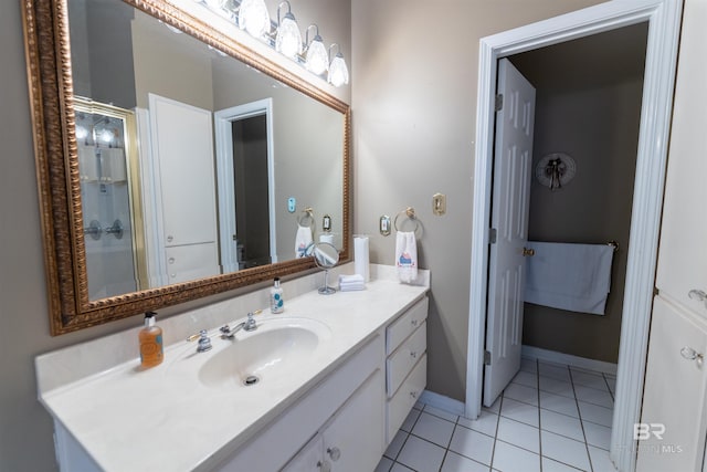 1619 Silver Creek Ct, Saraland, AL 36571 - bathroom featuring tile patterned floors, vanity, and a shower stall