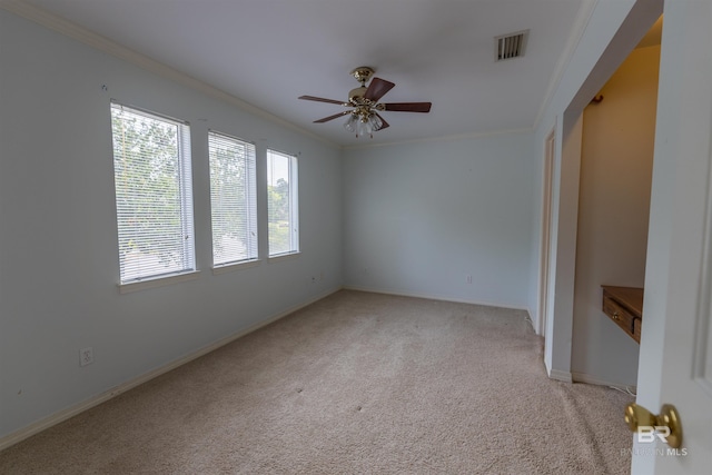 1619 Silver Creek Ct, Saraland, AL 36571 - empty room featuring crown molding, ceiling fan, and light carpet