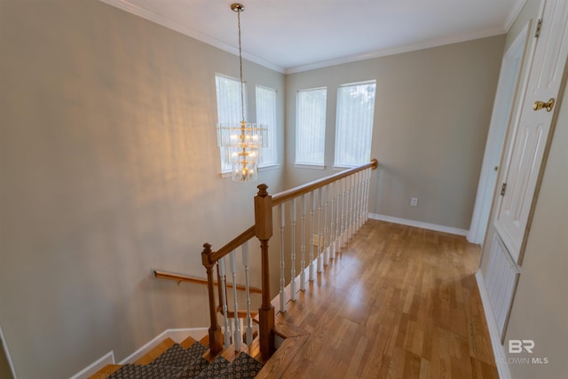 1619 Silver Creek Ct, Saraland, AL 36571 - stairs featuring wood finished floors, a chandelier, and crown molding