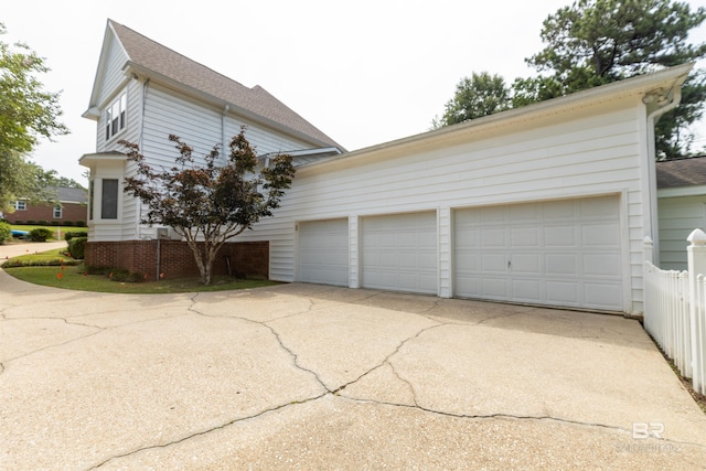1619 Silver Creek Ct, Saraland, AL 36571 - view of side of property featuring concrete driveway, a shingled roof, and a garage