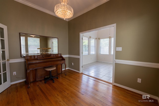 1619 Silver Creek Ct, Saraland, AL 36571 - home office with plenty of natural light, a chandelier, ornamental molding, and wood finished floors