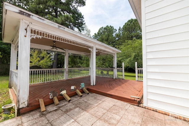 1619 Silver Creek Ct, Saraland, AL 36571 - wooden terrace with ceiling fan, view of wooded area, a gazebo, and a patio area