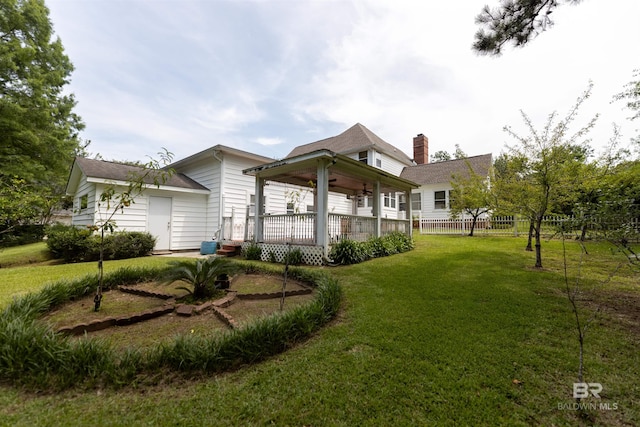 1619 Silver Creek Ct, Saraland, AL 36571 - rear view of house featuring a ceiling fan and a chimney