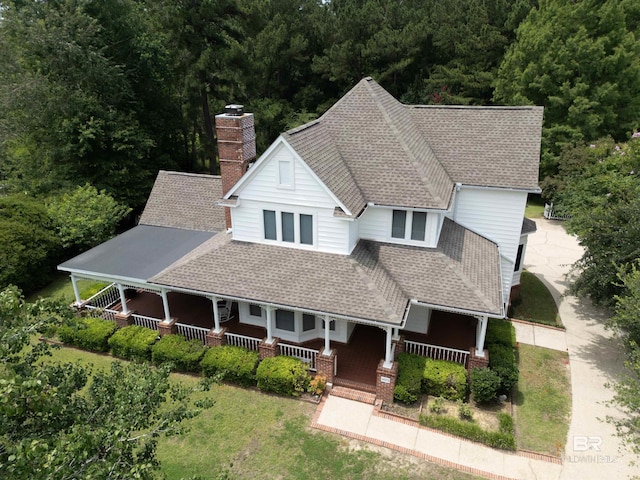 1619 Silver Creek Ct, Saraland, AL 36571 - view of front of property with a chimney, covered porch, roof with shingles, and a view of trees