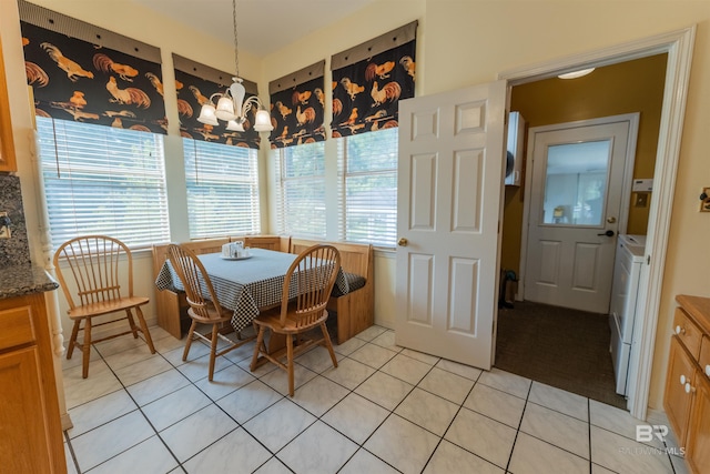 1619 Silver Creek Ct, Saraland, AL 36571 - dining area featuring light tile patterned floors and a chandelier