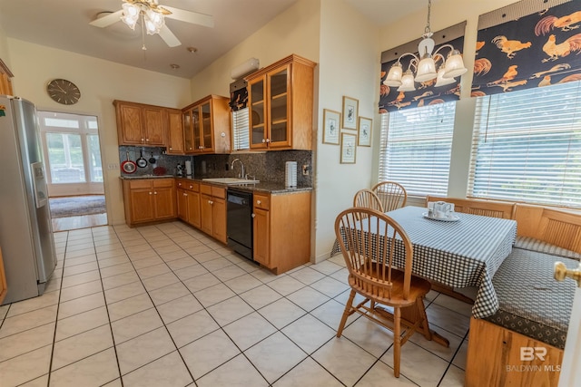 1619 Silver Creek Ct, Saraland, AL 36571 - kitchen featuring fridge with ice dispenser, dishwasher, backsplash, brown cabinetry, and a chandelier
