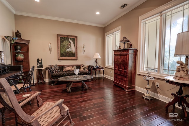 sitting room featuring dark hardwood / wood-style flooring and ornamental molding