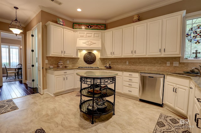 kitchen with stainless steel dishwasher, light stone counters, ornamental molding, sink, and white cabinetry