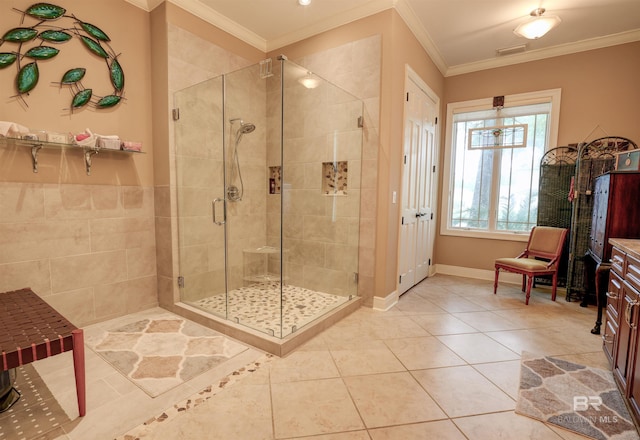 bathroom with tile patterned floors, ornamental molding, and walk in shower