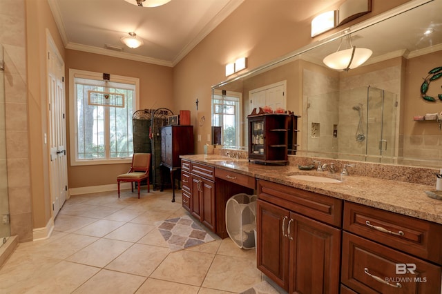 bathroom with a shower with door, a wealth of natural light, and crown molding