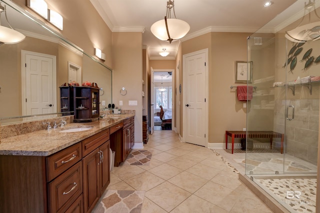 bathroom with walk in shower, vanity, and ornamental molding