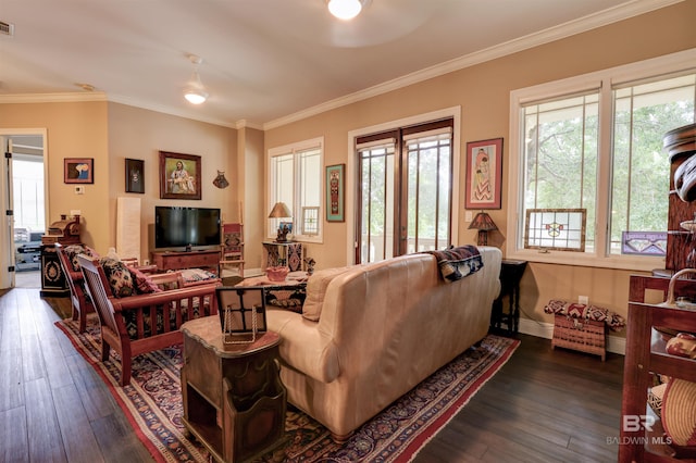 living room with dark hardwood / wood-style flooring and crown molding