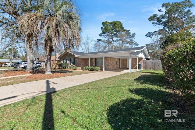 single story home featuring a carport and a front yard