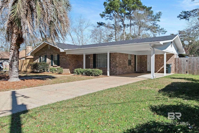 ranch-style home featuring a front lawn and a carport