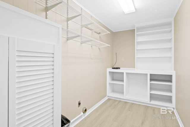 spacious closet featuring hardwood / wood-style flooring