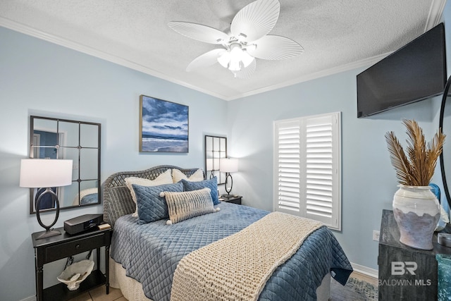 bedroom featuring ceiling fan, ornamental molding, a textured ceiling, and baseboards