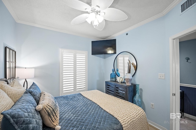 bedroom with ornamental molding, a textured ceiling, visible vents, ceiling fan, and baseboards