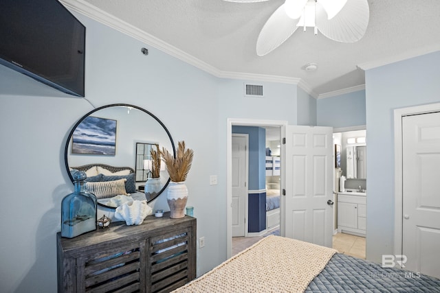 bedroom featuring light tile patterned flooring, visible vents, crown molding, ceiling fan, and connected bathroom