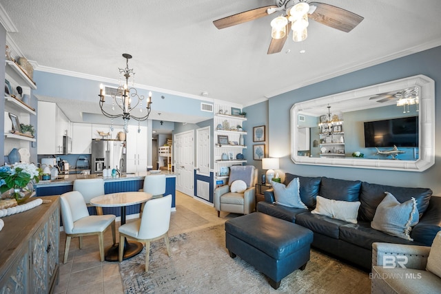 living room featuring light tile patterned floors, ornamental molding, visible vents, and ceiling fan with notable chandelier