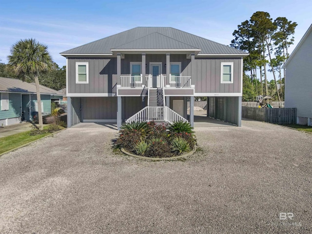 beach home with a garage and a porch