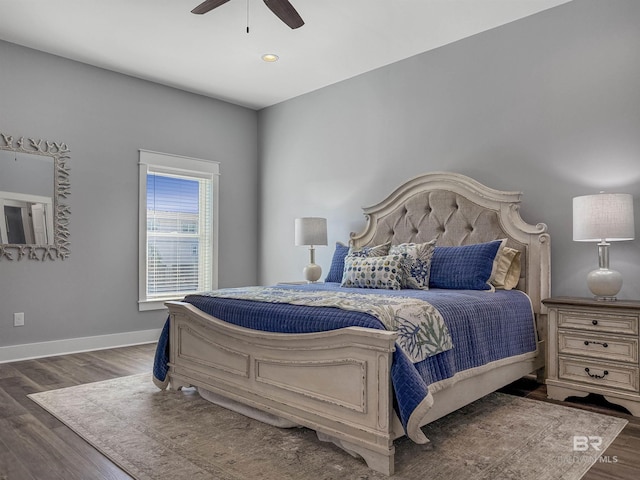 bedroom featuring ceiling fan and dark wood-type flooring