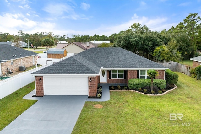 ranch-style home with a garage and a front lawn