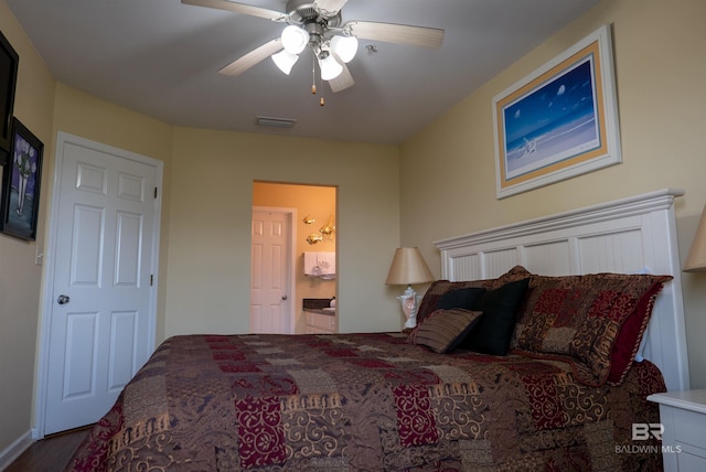 bedroom with visible vents, ceiling fan, and ensuite bath