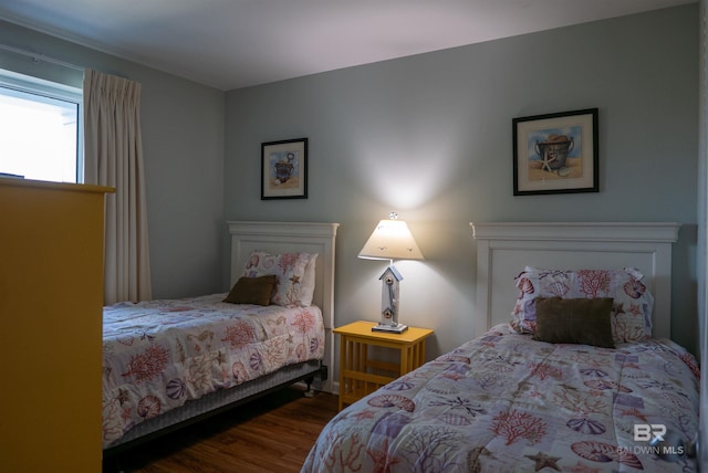 bedroom featuring wood finished floors