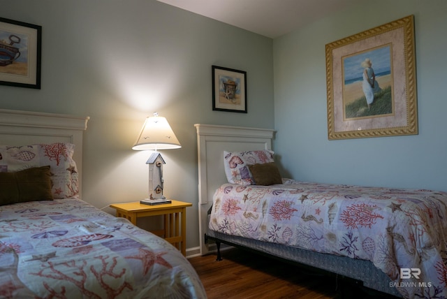 bedroom with wood finished floors