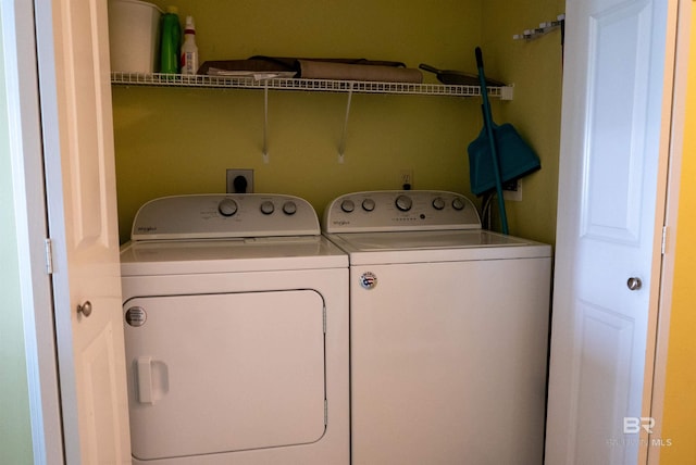 laundry room with separate washer and dryer and laundry area