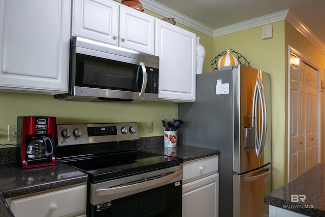 kitchen with stainless steel appliances, white cabinets, and crown molding