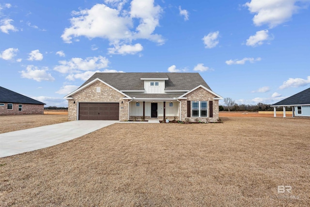 craftsman-style house with a garage, a front yard, and a porch