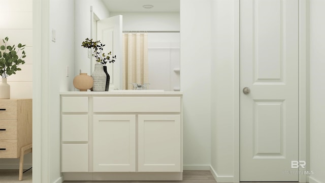 bathroom with vanity and a shower with curtain