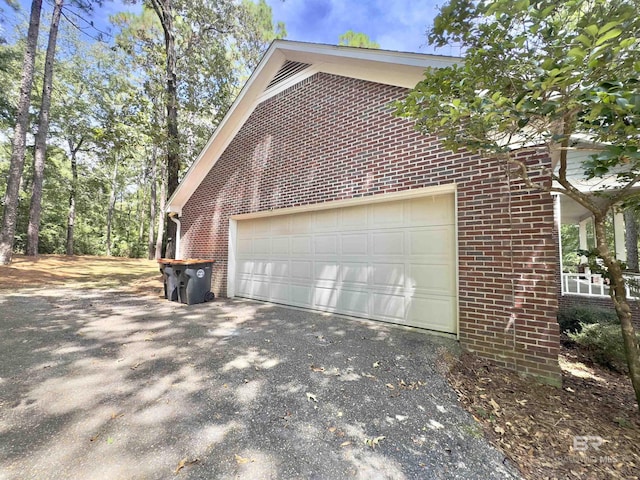 603 Northshore Dr, Bay Minette, AL 36507 - view of home's exterior with brick siding, asphalt driveway, and an attached garage
