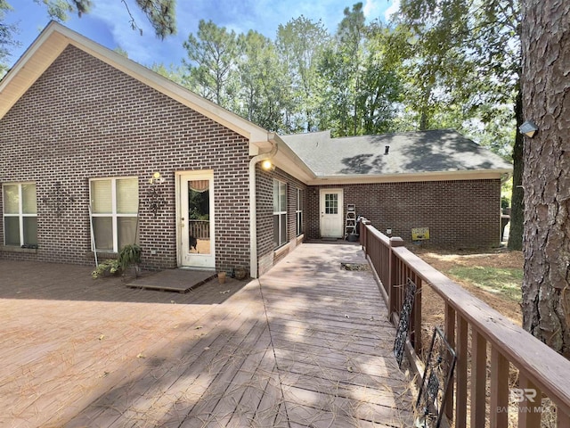 603 Northshore Dr, Bay Minette, AL 36507 - rear view of property featuring brick siding, a deck, and a shingled roof
