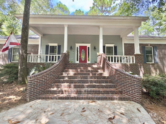 603 Northshore Dr, Bay Minette, AL 36507 - doorway to property featuring brick siding and covered porch
