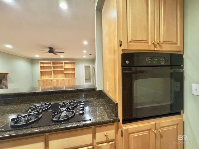 603 Northshore Dr, Bay Minette, AL 36507 - kitchen featuring black appliances, light brown cabinets, recessed lighting, dark stone countertops, and arched walkways